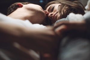 man and a woman in the bed